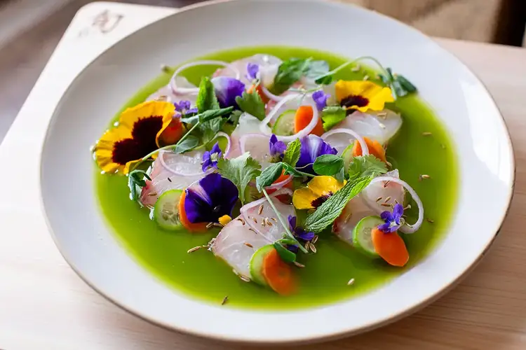 A plated setting of vibrant Snapper Aguachile